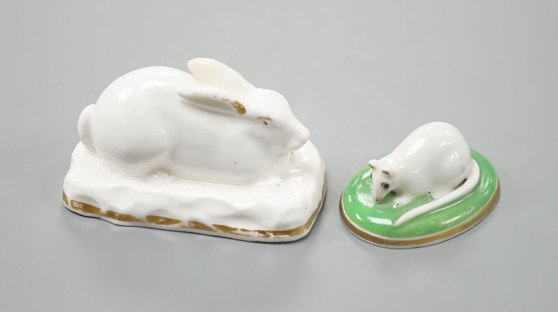 A rare Grainger Lee and co. porcelain model of a recumbent rabbit, c.1820-37, unmarked, 5.8 cm long and a Chamberlains porcelain model a recumbent mouse, c.1820-40, 3.9 cm long, Cf. Dennis G.Rice, English porcelain anima